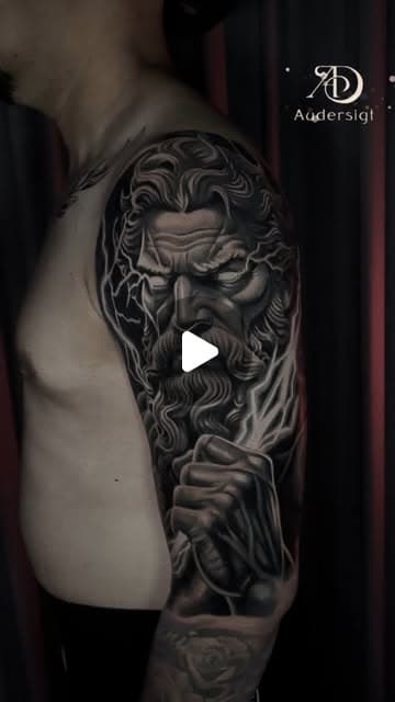 Tattoo artist creating a full sleeve with Audersigt professional tattoo equipment.